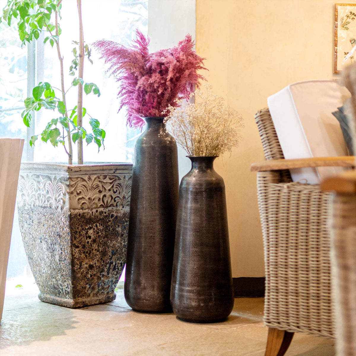 Tall metal vase with small mouth