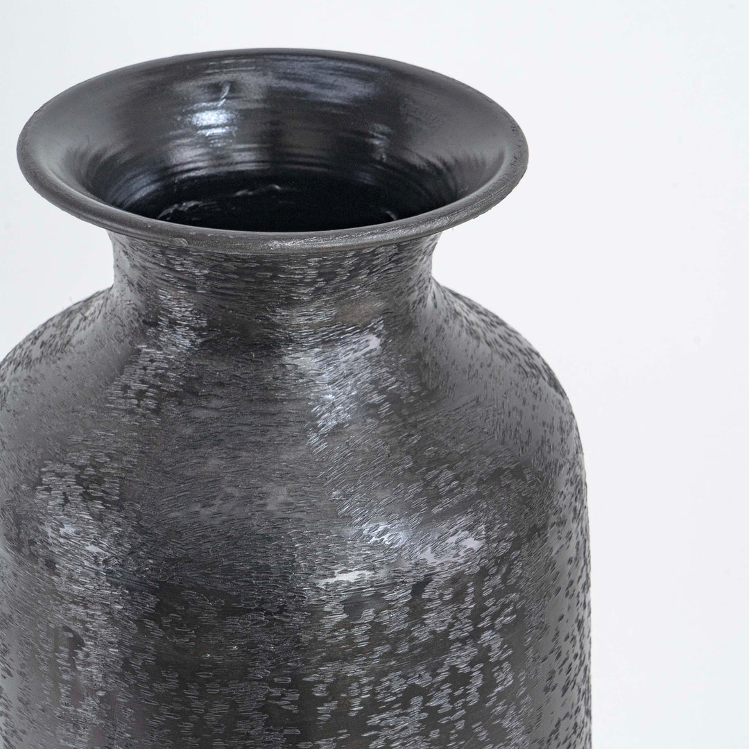 Tall metal vase with small mouth